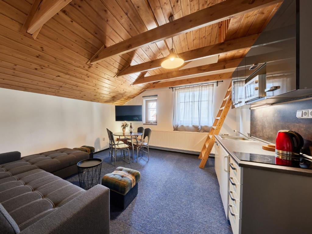 a living room with a couch and a table at Apartment Marika 2 by Interhome in Cerny Dul