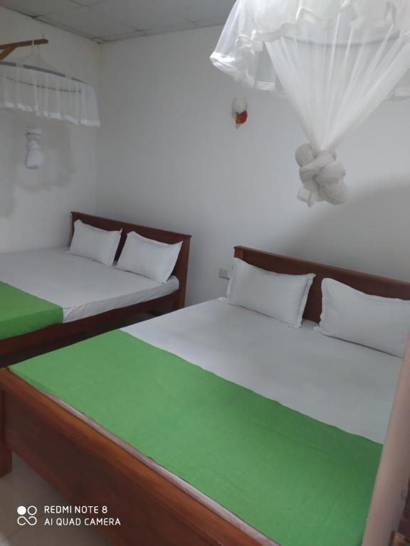 Postel nebo postele na pokoji v ubytování Umaya Holiday Home