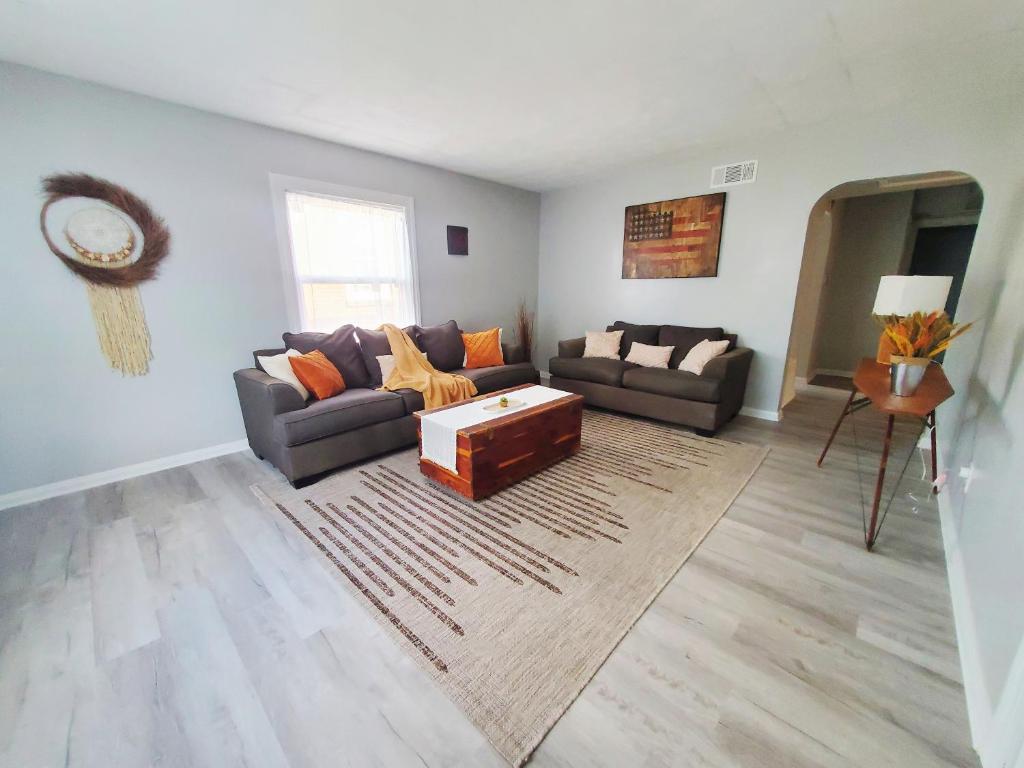 a living room with a couch and a coffee table at Room Near Downtown UofL,Airport&ExpoCenter in Louisville