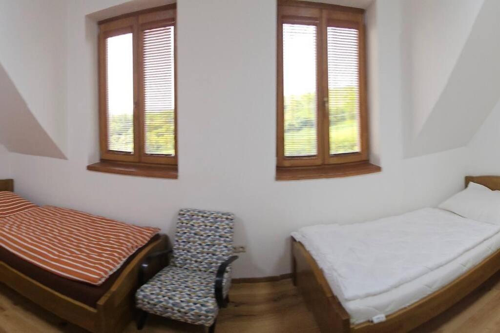 Postel nebo postele na pokoji v ubytování Vinársky dom u kríža