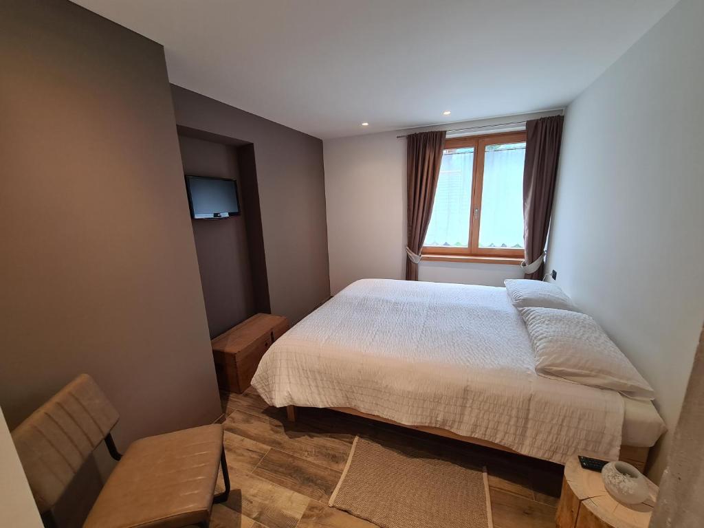Postel nebo postele na pokoji v ubytování K2 home