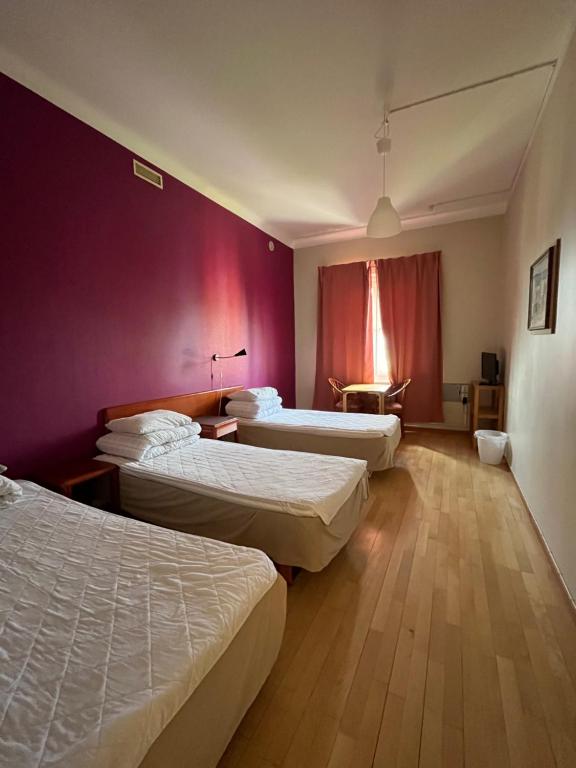 Postel nebo postele na pokoji v ubytování Carlstad Sport Hostel