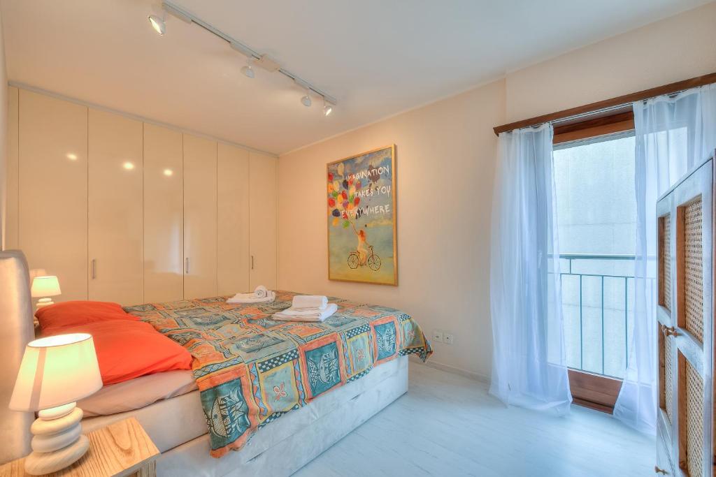 Postel nebo postele na pokoji v ubytování Emotion Lake View - Happy Rentals