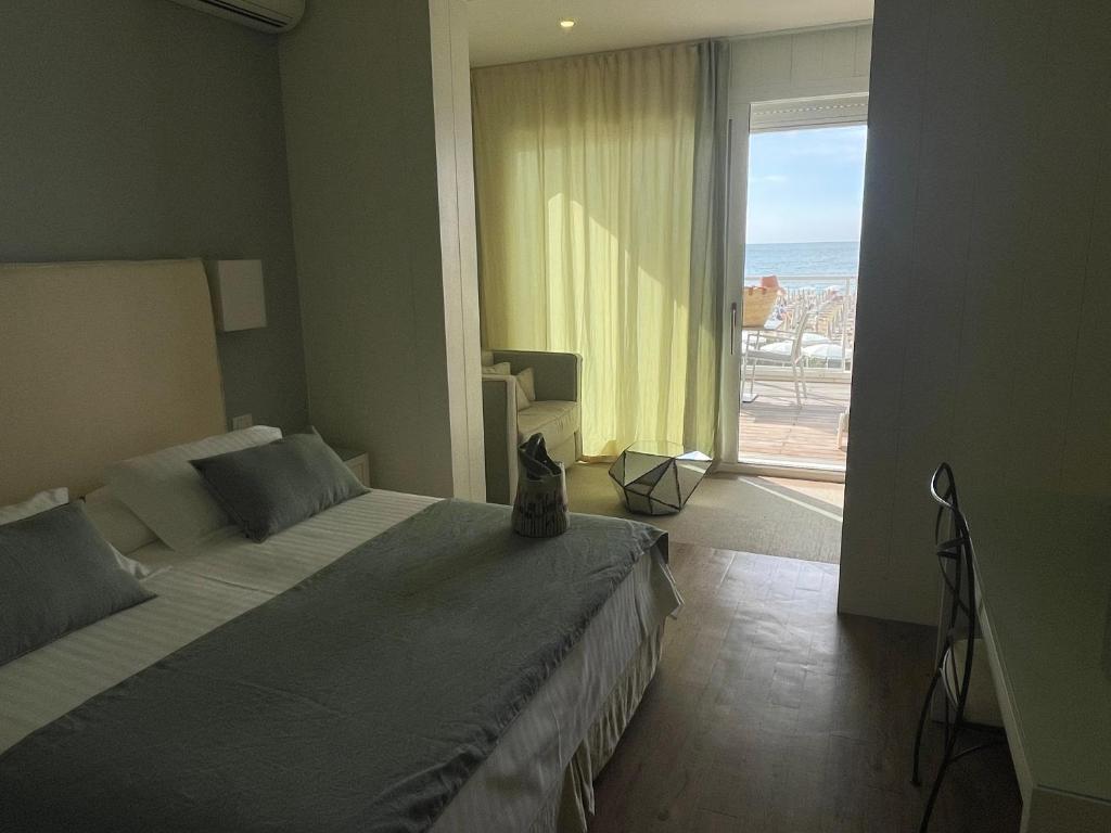 Postel nebo postele na pokoji v ubytování Hotel Ril