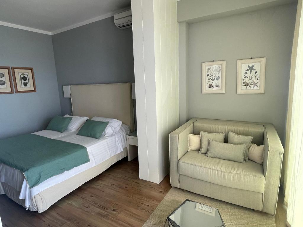 Postel nebo postele na pokoji v ubytování Hotel Ril