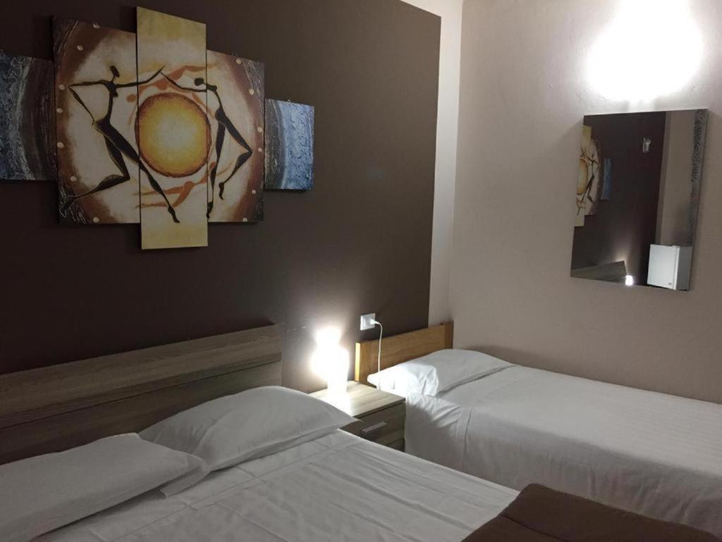Postel nebo postele na pokoji v ubytování Residence albergo SELF CHECK-IN