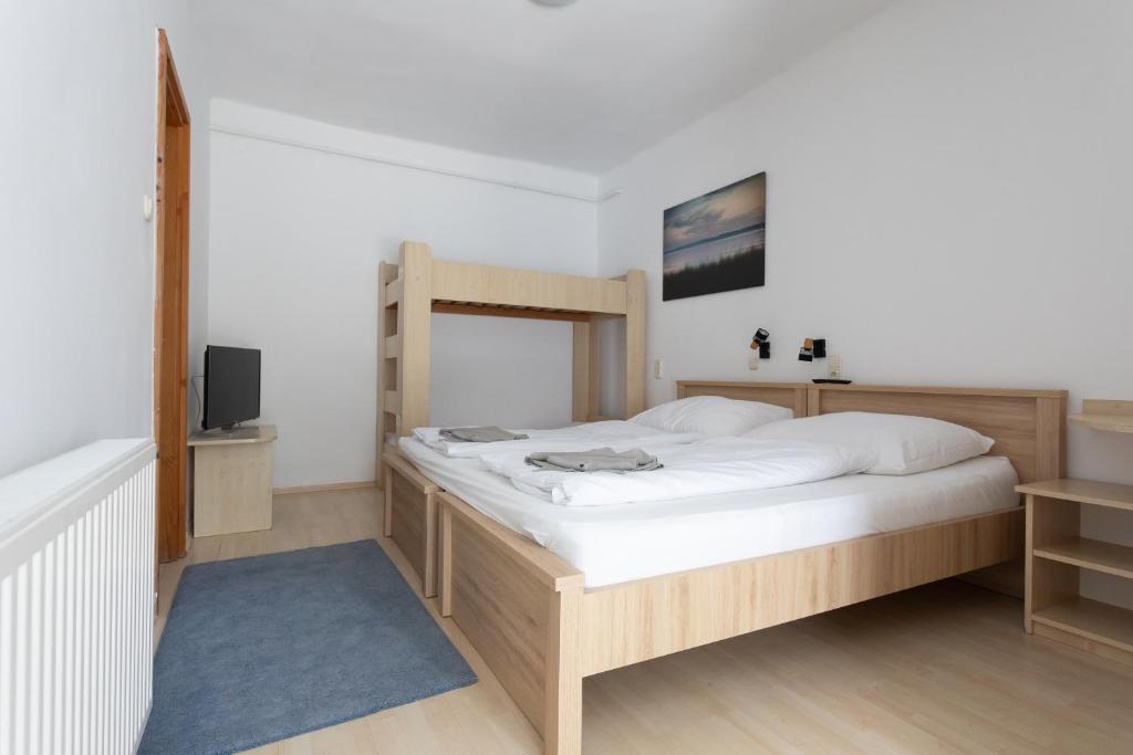 Postel nebo postele na pokoji v ubytování Hotel Platán