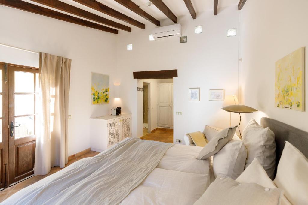 Posteľ alebo postele v izbe v ubytovaní Finca Can Coll Boutique Country House - Adults Only