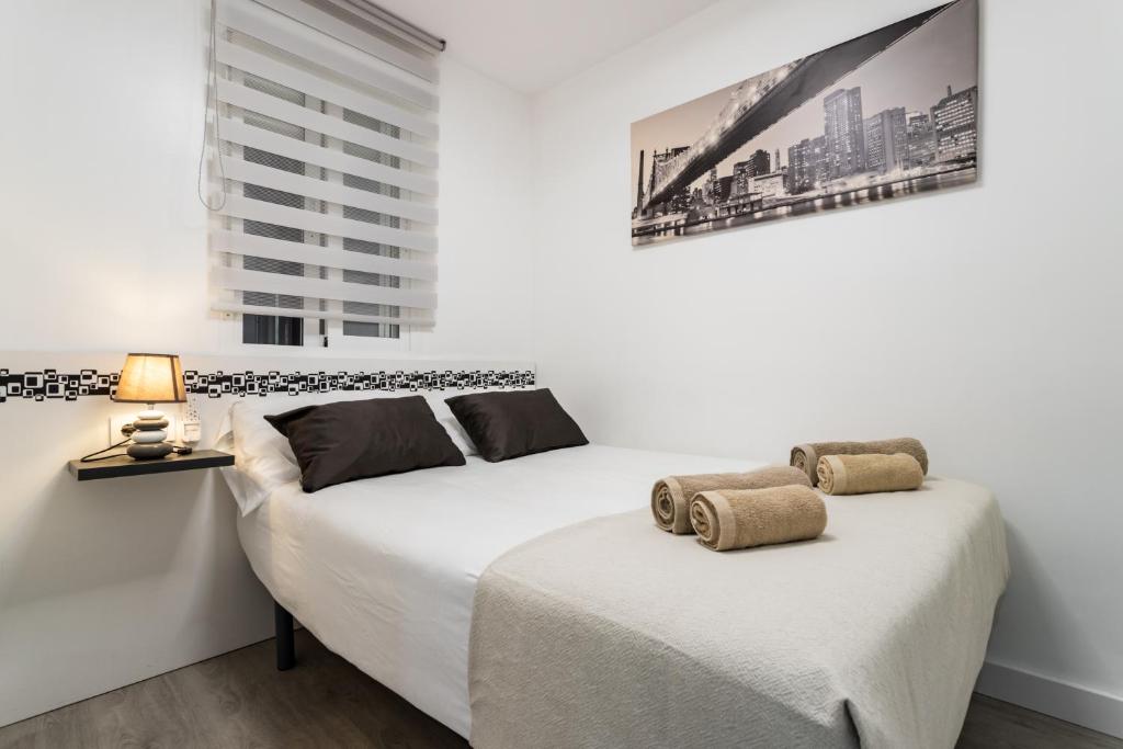 Posteľ alebo postele v izbe v ubytovaní Sur Suites Principe