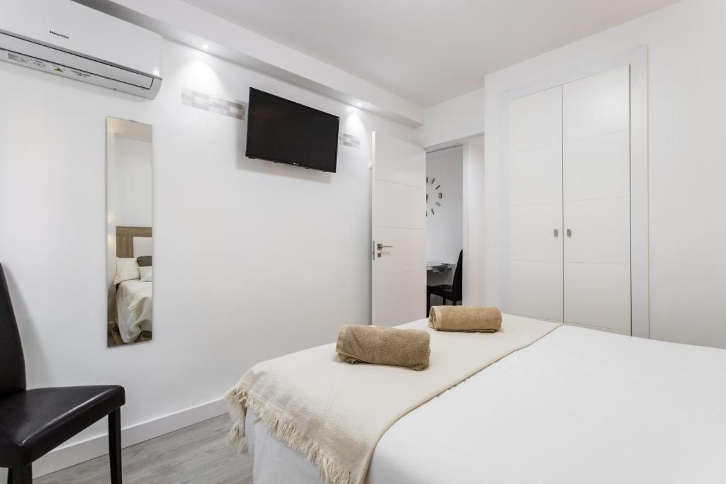 Posteľ alebo postele v izbe v ubytovaní Sur Suites Principe