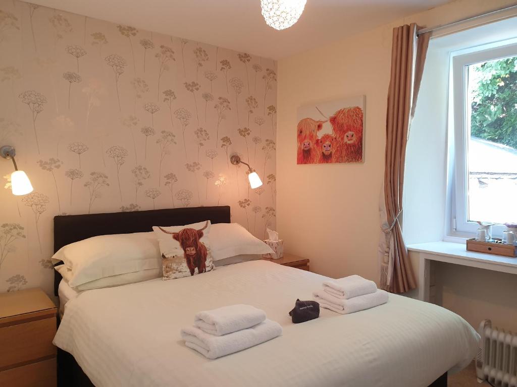 Postel nebo postele na pokoji v ubytování Carnaburg Guesthouse