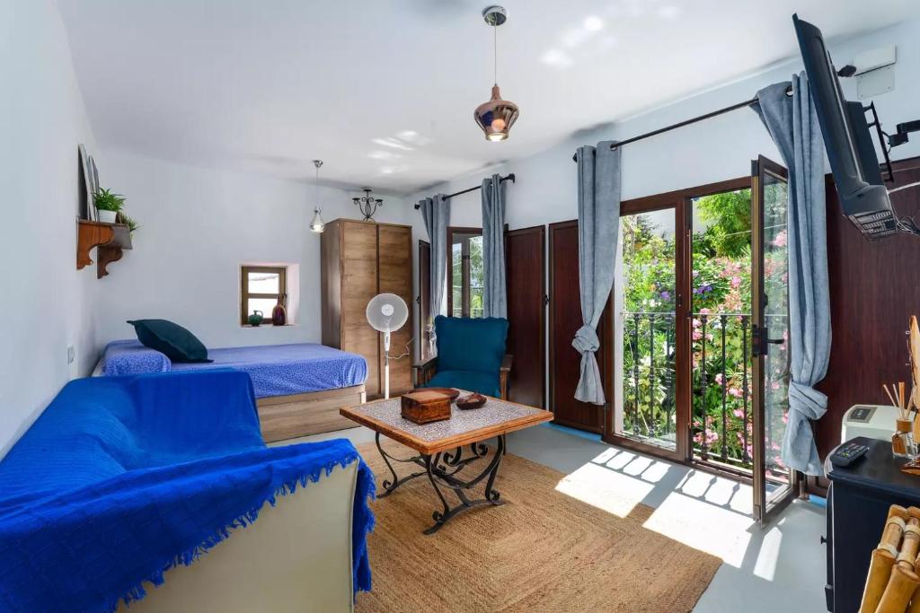 Łóżko lub łóżka w pokoju w obiekcie La casita de Casares