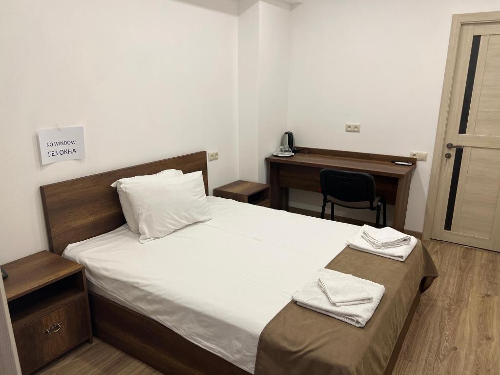 Postel nebo postele na pokoji v ubytování Patriott Hotel