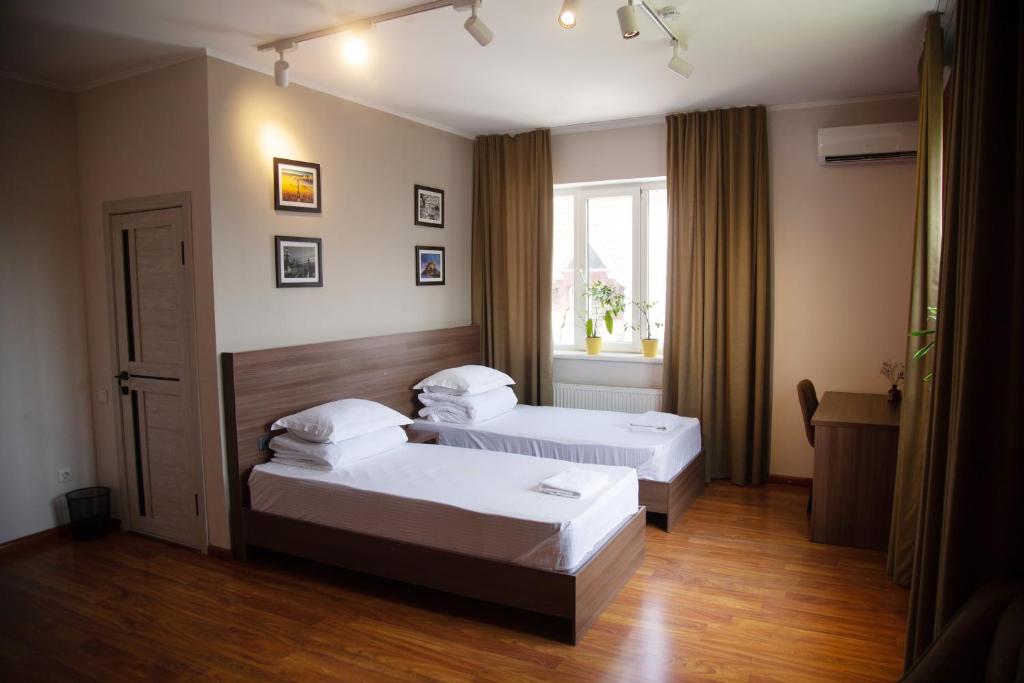 Postel nebo postele na pokoji v ubytování People Guest House