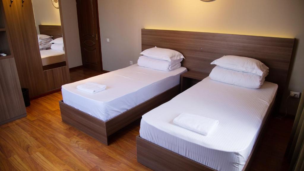 Postel nebo postele na pokoji v ubytování People Guest House
