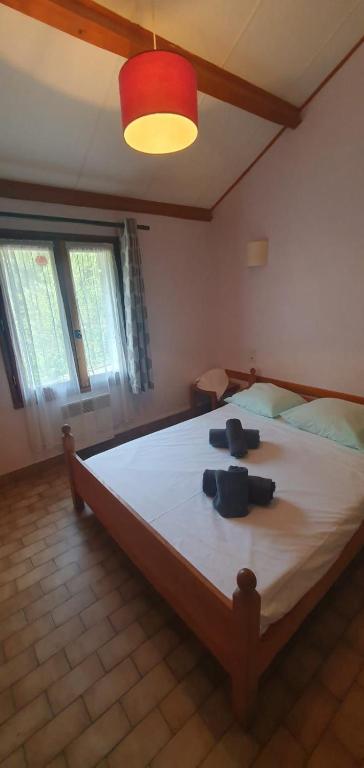 Postel nebo postele na pokoji v ubytování Hôtel des Bateliers