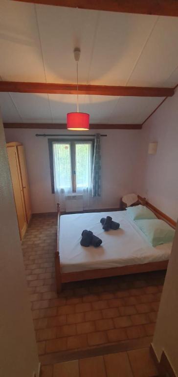 Postel nebo postele na pokoji v ubytování Hôtel des Bateliers