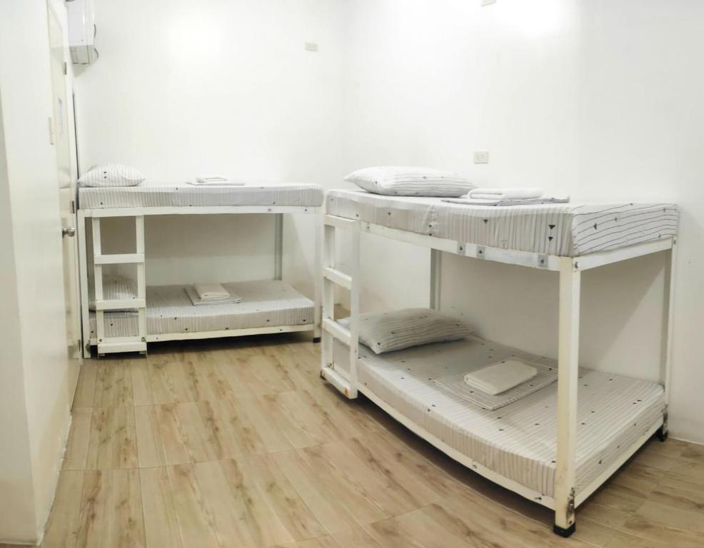 Postel nebo postele na pokoji v ubytování Pasay Centrale Hotel
