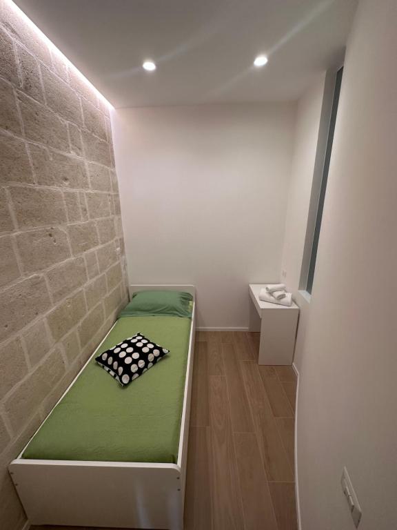 Postel nebo postele na pokoji v ubytování Il Tufo In Festa