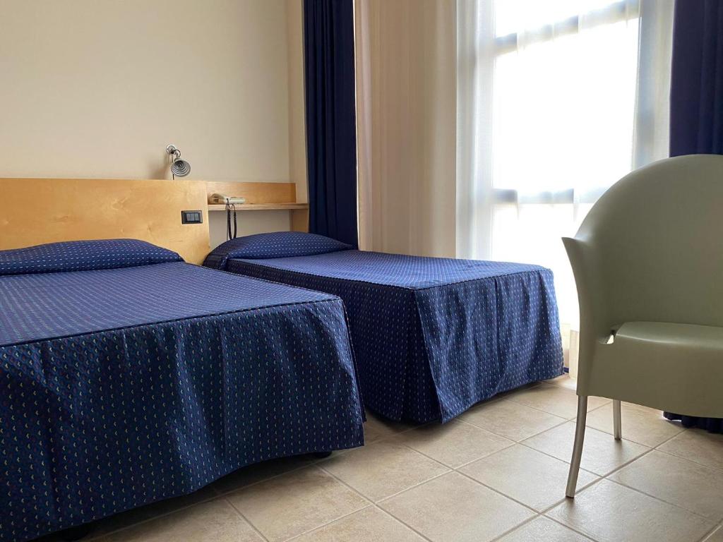 Postel nebo postele na pokoji v ubytování Albergo Ristorante Saverino
