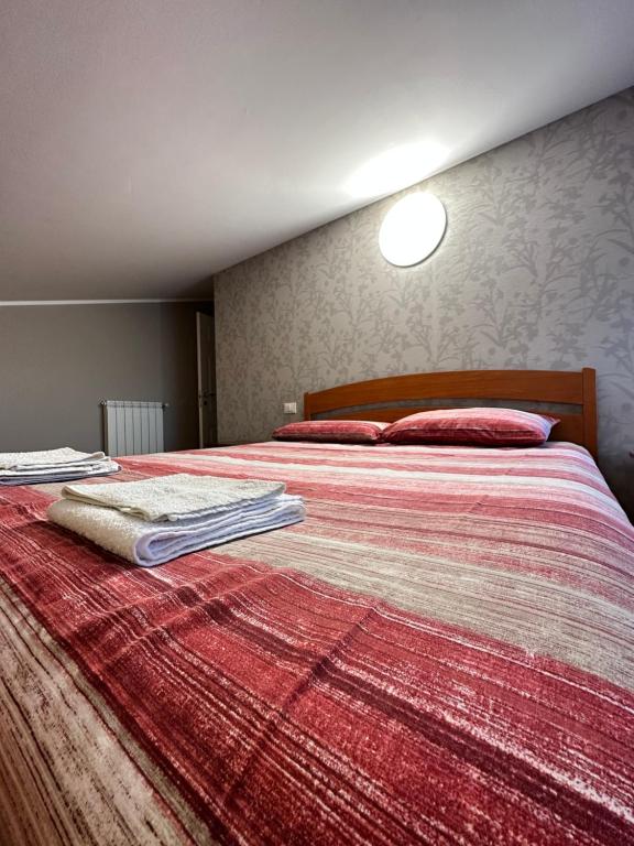 Ένα ή περισσότερα κρεβάτια σε δωμάτιο στο Casa Olivastri