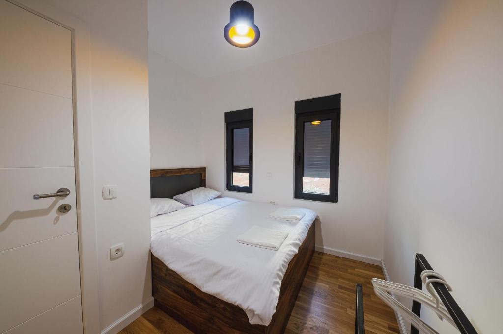 Postel nebo postele na pokoji v ubytování KOKO VILLAGE