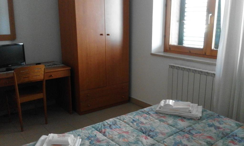 Postel nebo postele na pokoji v ubytování Osteria dei Locandieri