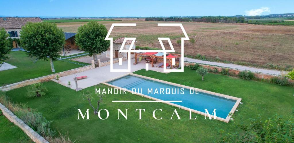 una vista aérea de una casa con piscina en Manoir du Marquis de Montcalm, en Vestric-et-Candiac