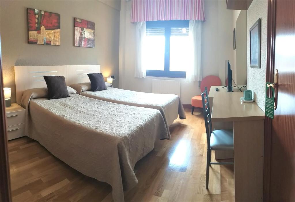 Postel nebo postele na pokoji v ubytování Alojamientos Pamplona
