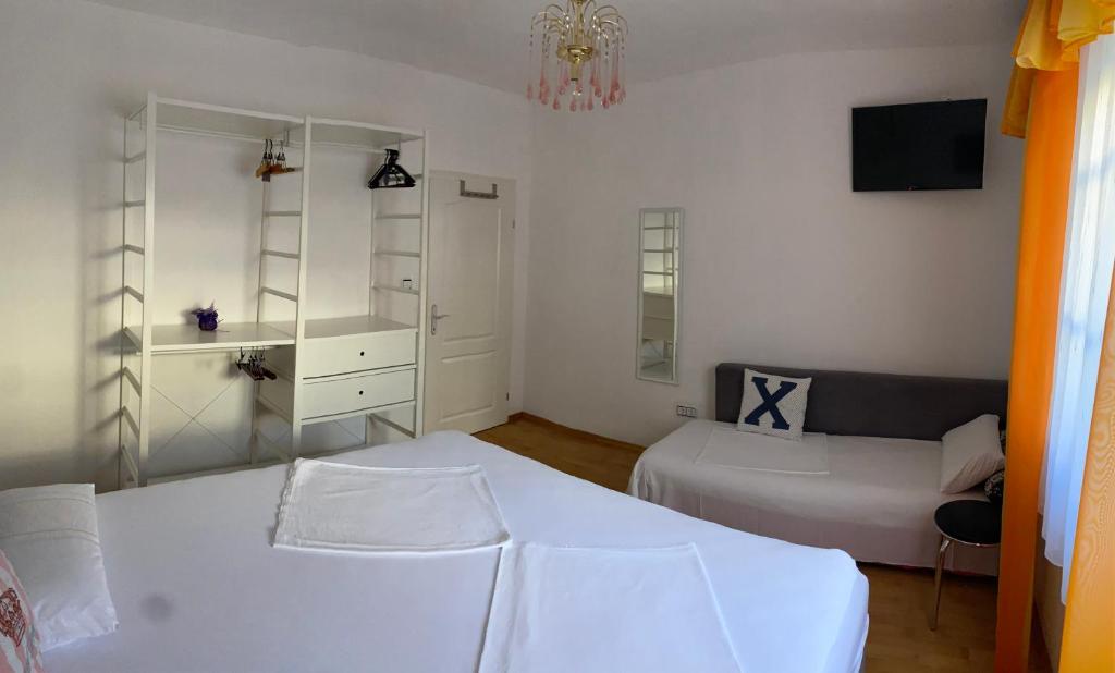 Łóżko lub łóżka w pokoju w obiekcie Apartments Matkovic