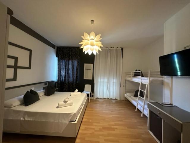 Postel nebo postele na pokoji v ubytování Athos Hotel