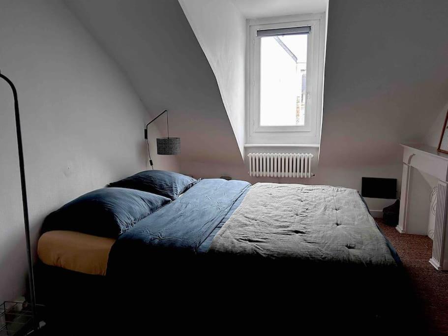 Llit o llits en una habitaci&oacute; de L&#39;Odet - Superbe vue sur les quais - Hyper Centre