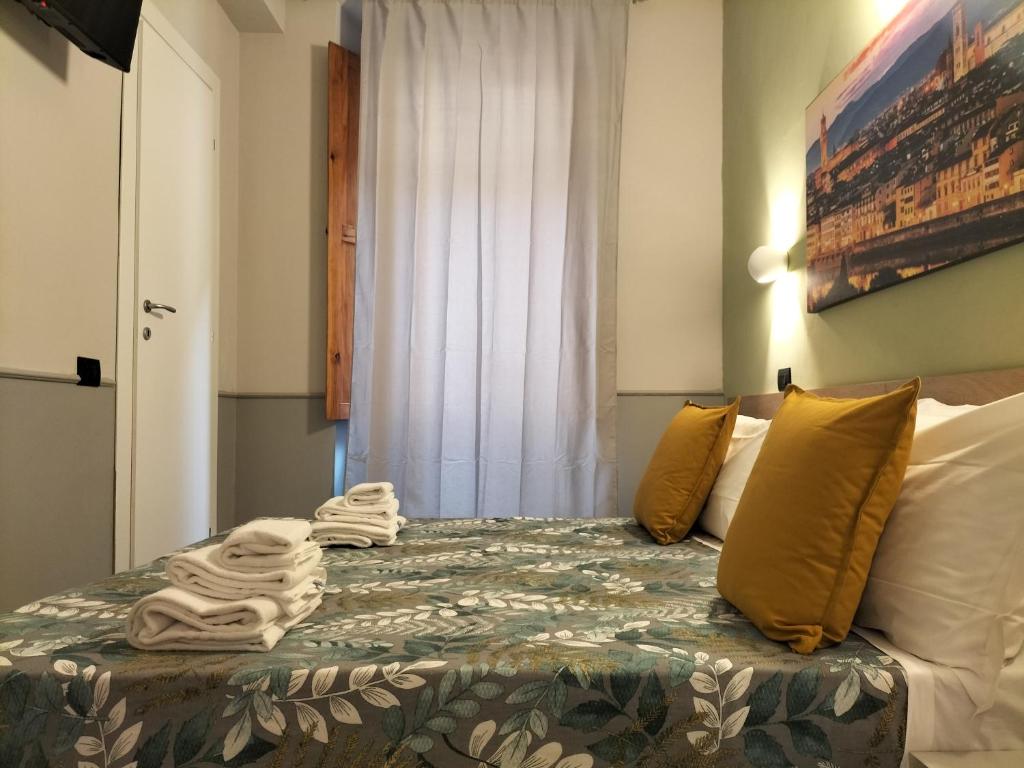 Posteľ alebo postele v izbe v ubytovaní Hotel Camilla Guelfa