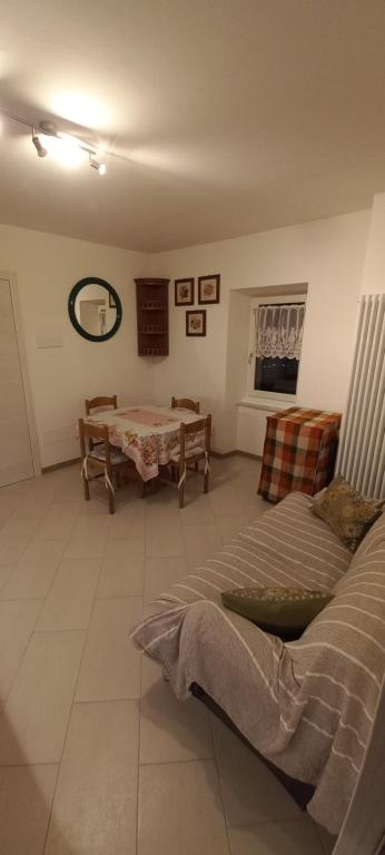 Postel nebo postele na pokoji v ubytování casa floriani fiavè green