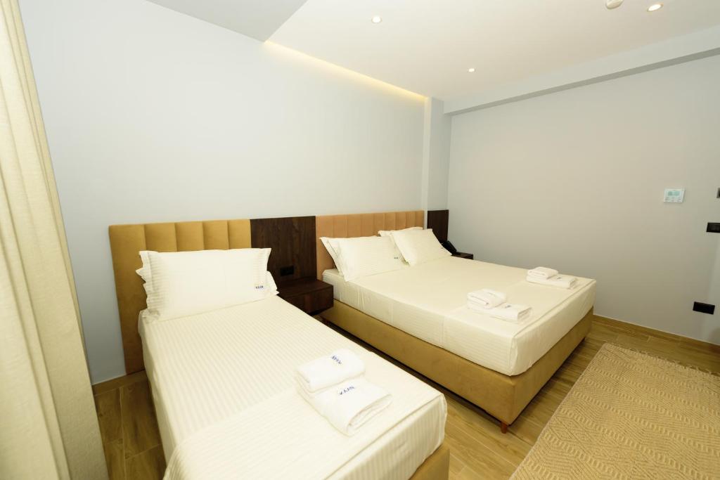 Postel nebo postele na pokoji v ubytování KAAN Hotel