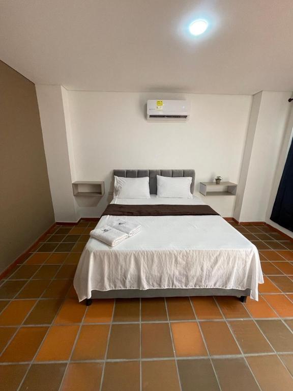 Postel nebo postele na pokoji v ubytování Hotel Valle Central