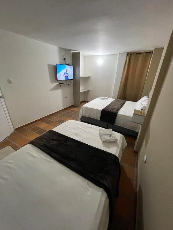 Postel nebo postele na pokoji v ubytování Hotel Valle Central