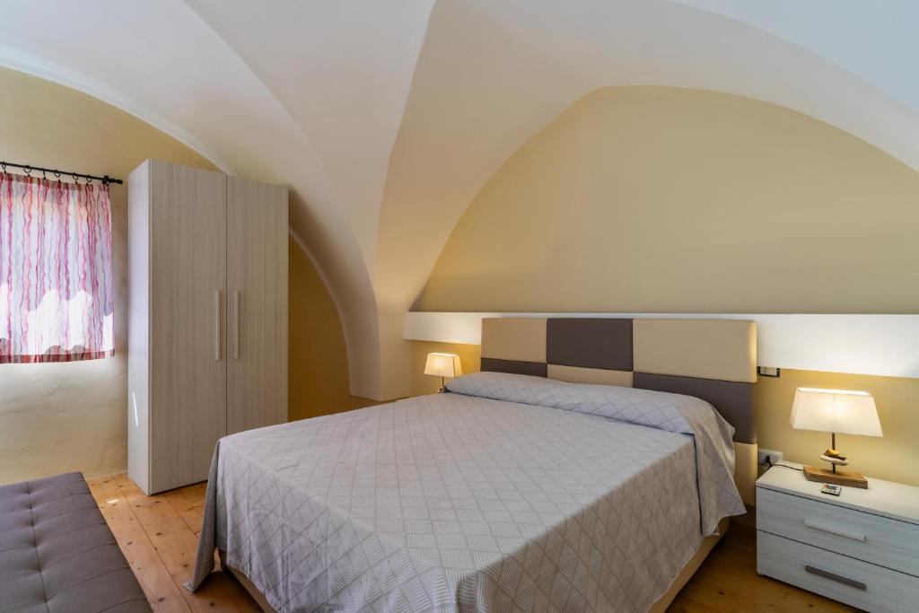 Postel nebo postele na pokoji v ubytování La rimesa di Tittì - Simone