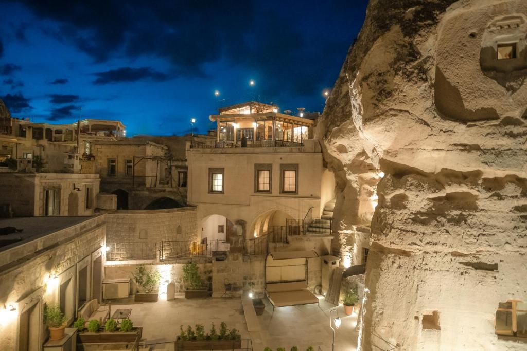 a view of a building at night with lights at Sora Cave Hotel in Goreme