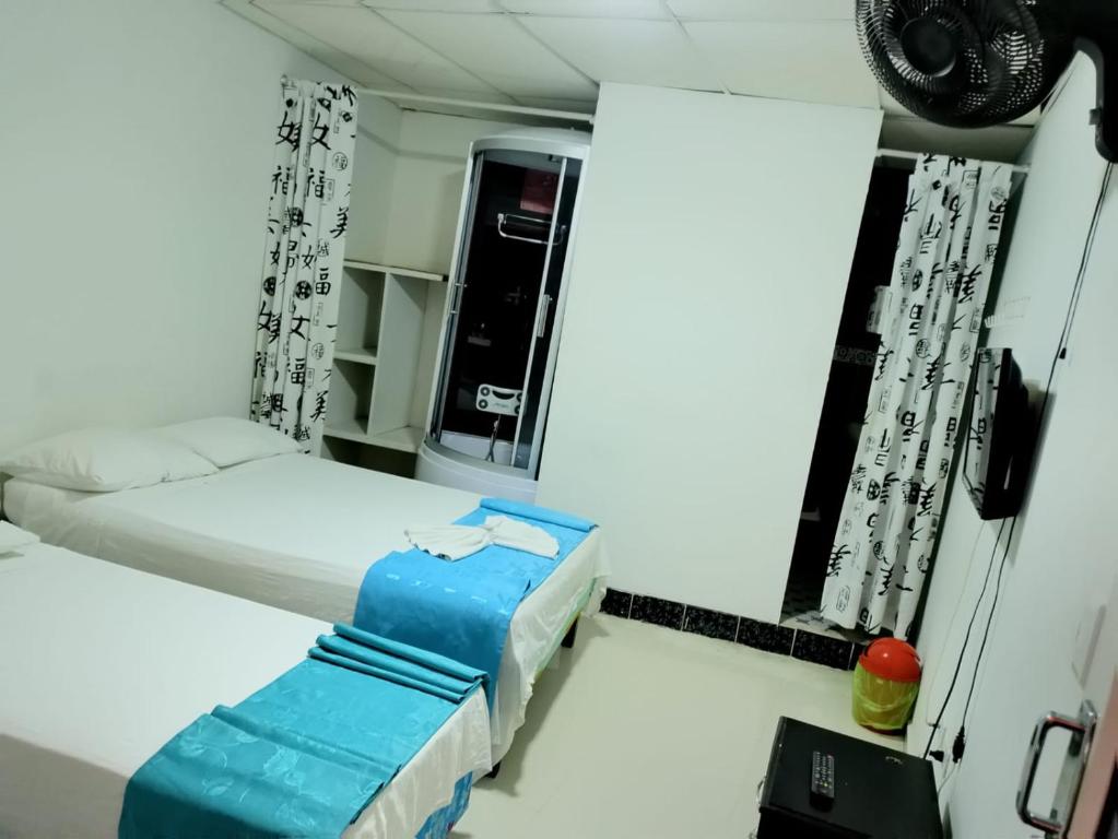 Postel nebo postele na pokoji v ubytování Hotel flamingo real T
