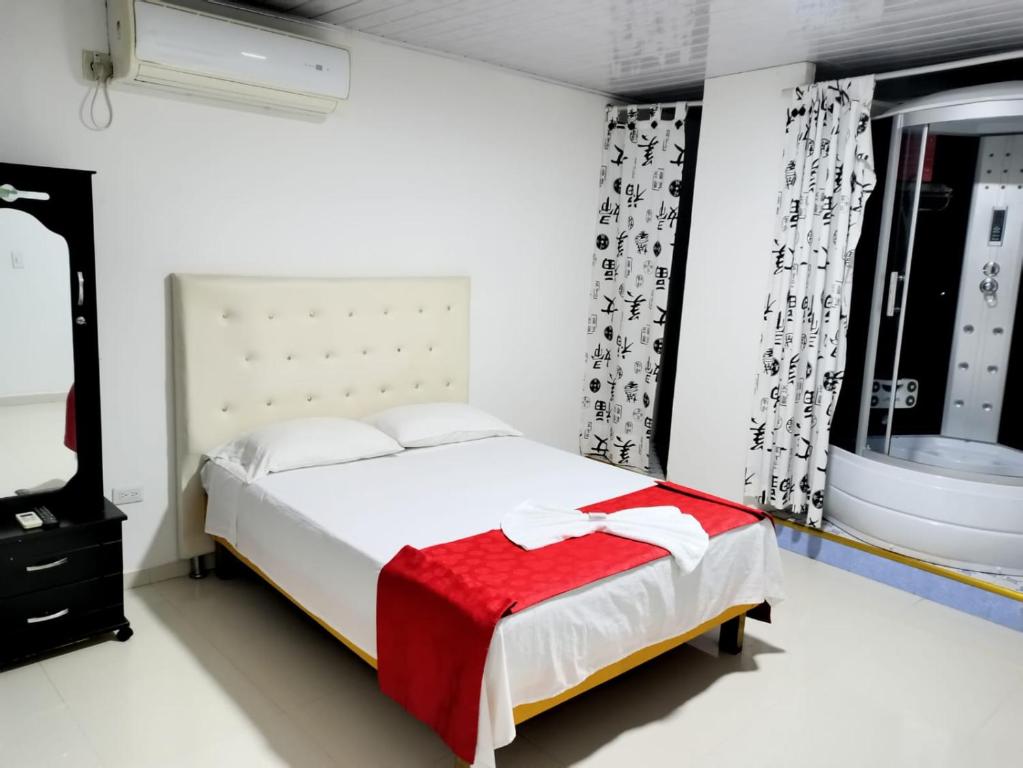 Postel nebo postele na pokoji v ubytování Hotel flamingo real T