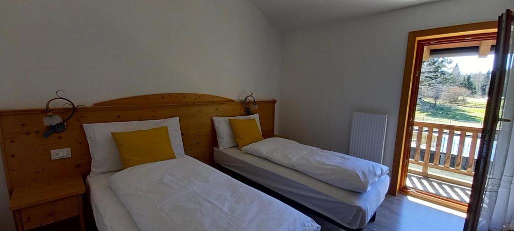 Postel nebo postele na pokoji v ubytování Locanda Val Canali