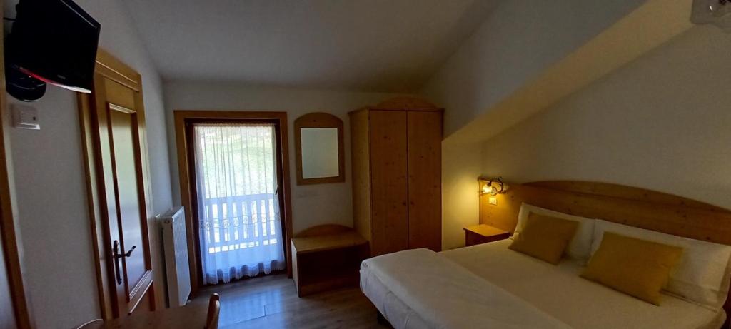 Postel nebo postele na pokoji v ubytování Locanda Val Canali
