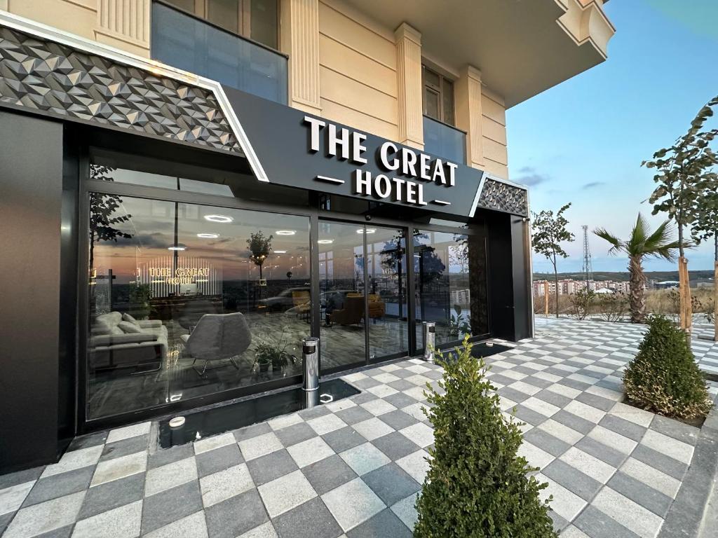 a hotel with a sign that reads the great hotel at The Great Airport Hotel in Arnavutköy