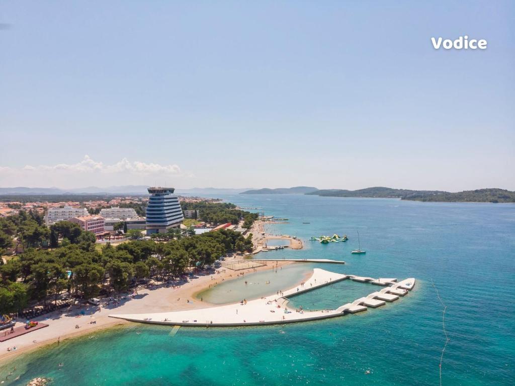 an aerial view of a beach and the ocean at Villa Lucia in Skradin