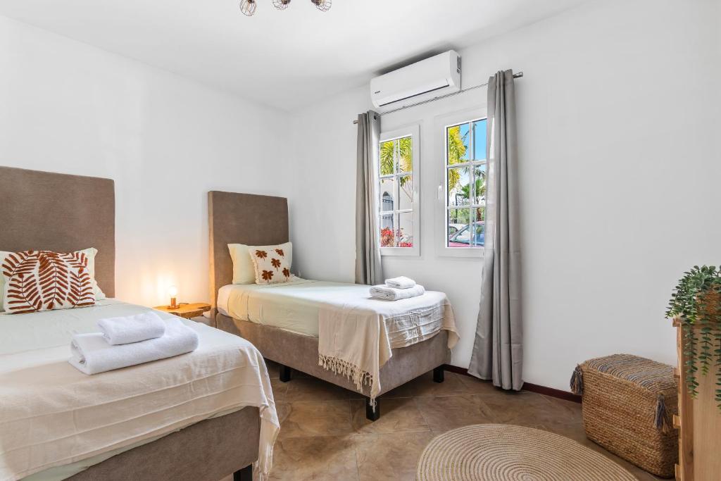 Postel nebo postele na pokoji v ubytování Casa Brasa Jan Thiel