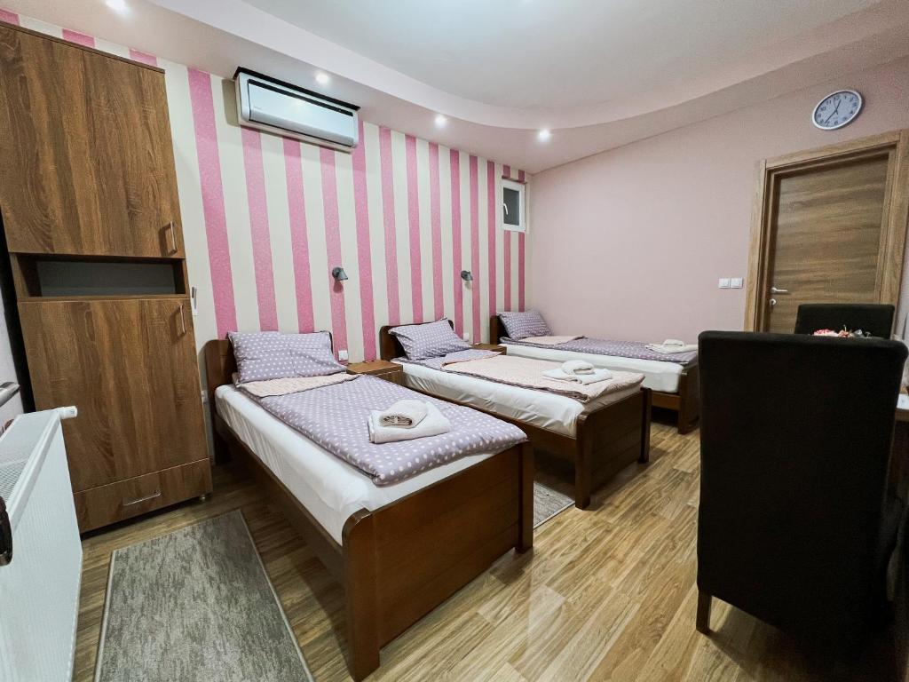 Postel nebo postele na pokoji v ubytování Migro Lux sobe