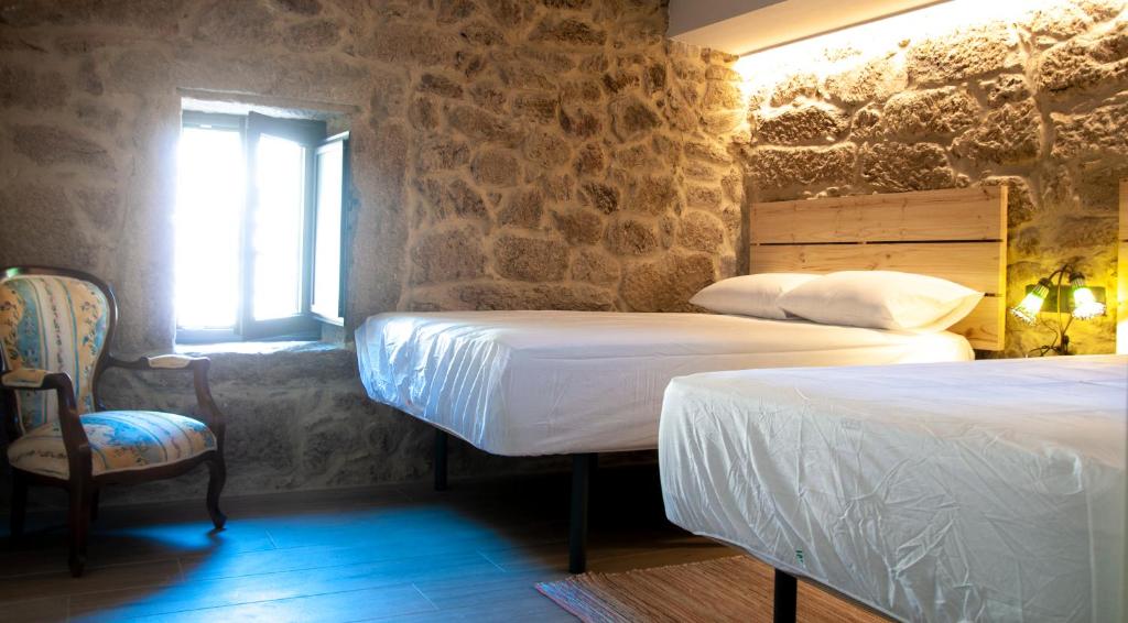 Postel nebo postele na pokoji v ubytování Casa D'Mina