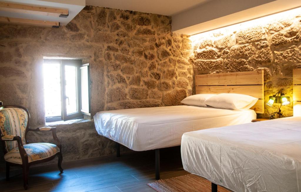 Postel nebo postele na pokoji v ubytování Casa D'Mina