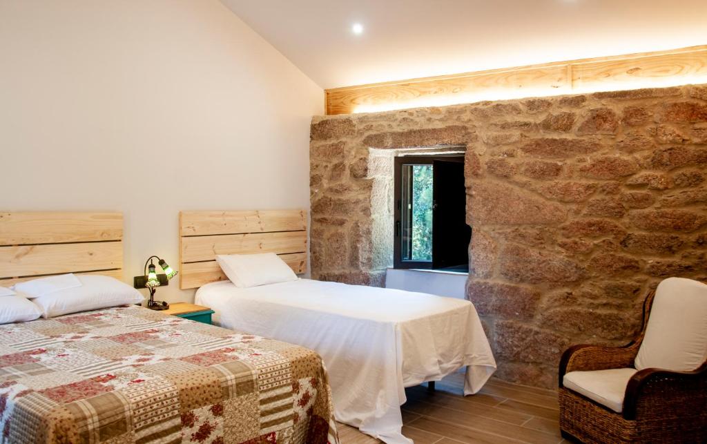 Postel nebo postele na pokoji v ubytování Casa D'Mina